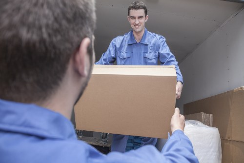 Local removal team preparing a Pinner home move with boxes and furniture