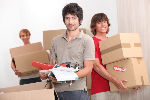 Trained moving staff loading items safely into a van