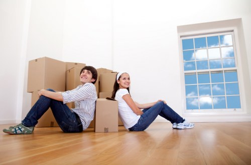Packed office equipment and furniture prepared for transport in Pinner