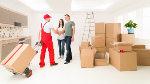 Packed office boxes and labelled equipment ready for commercial moves in Pinner