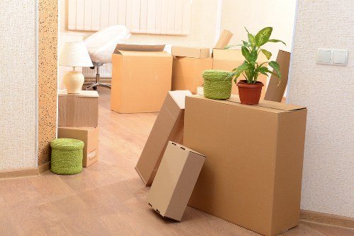Removal team handling furniture during house removals in Pinner